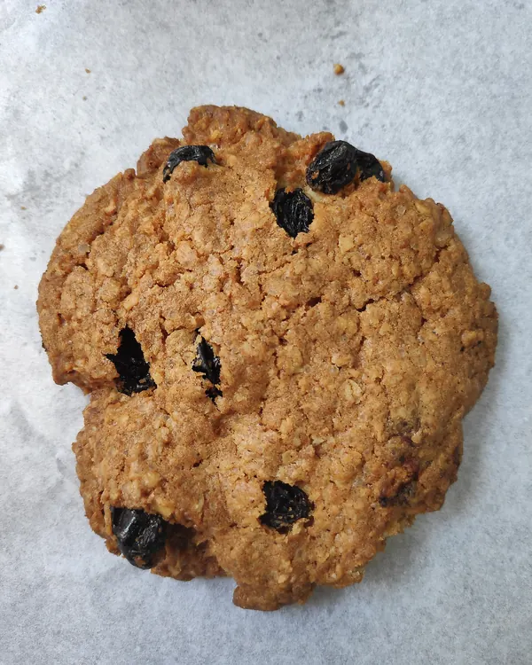 Oatmeal raisin cookie on white paper