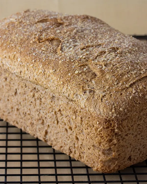 Whole wheat loaf on a cooling rack